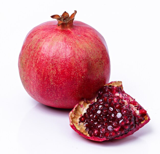 Delicious pomegranate on white