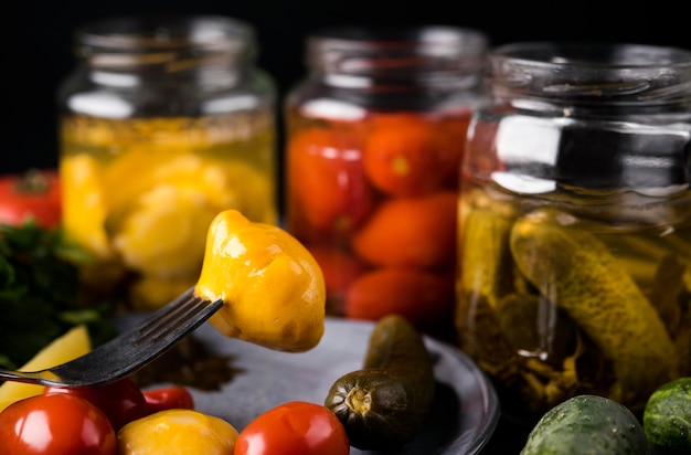 Delicious preserved vegetables in jars