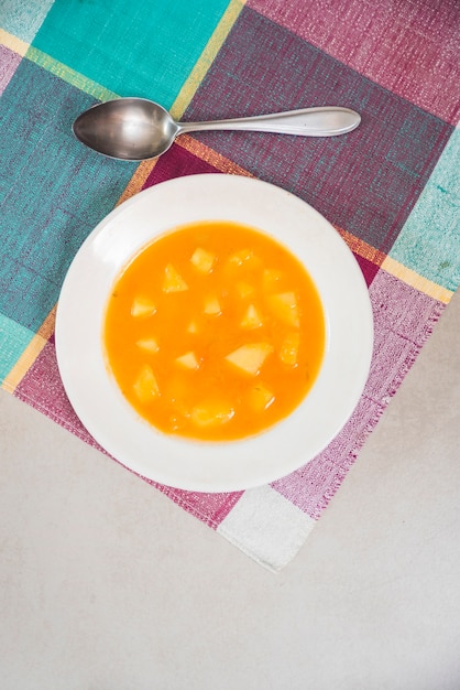 Free photo delicious pumpkin puree on plate on napkin