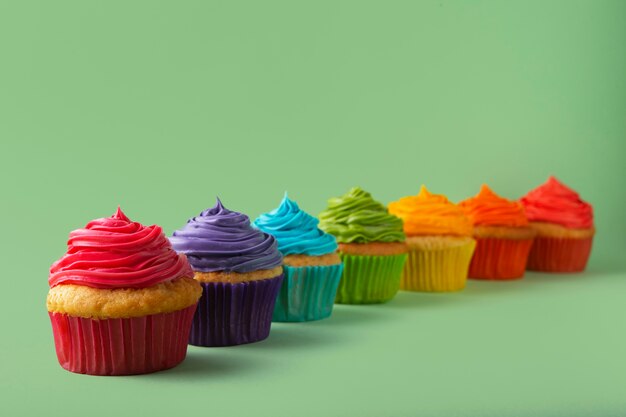Delicious rainbow cupcakes still life