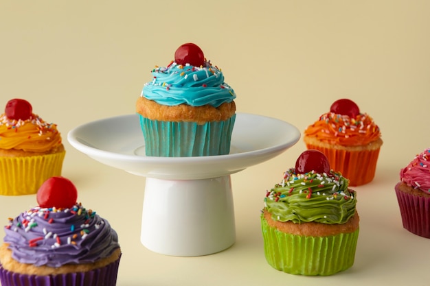 Free photo delicious rainbow cupcakes still life