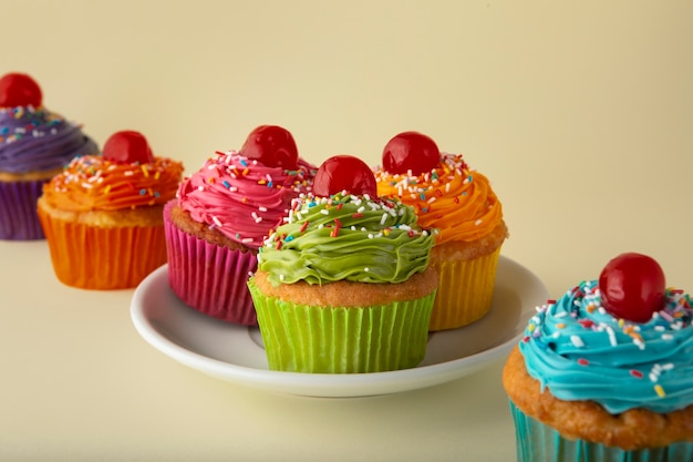 Free photo delicious rainbow cupcakes still life