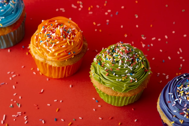 Delicious rainbow cupcakes still life