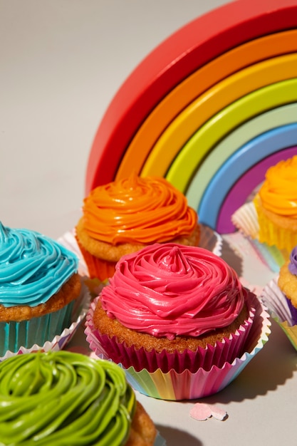 Free photo delicious rainbow cupcakes still life