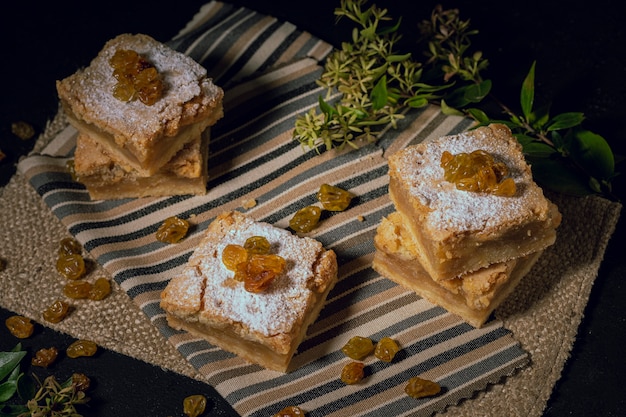 Delicious raisin pies on burlap fabric