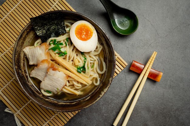 Delicious ramen on dark surface