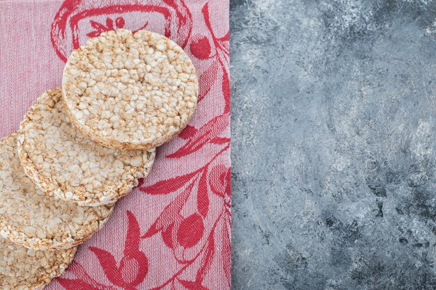 Delicious rice cakes on red cloth.