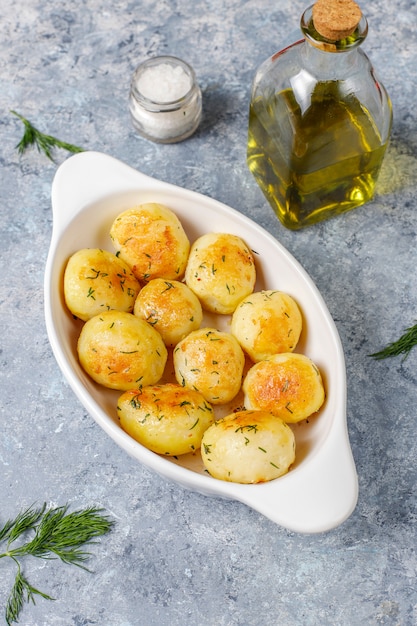 Delicious roasted young potatoes with dill,top view