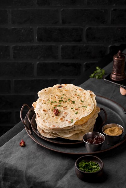 Delicious roti arrangement on the table with copy space