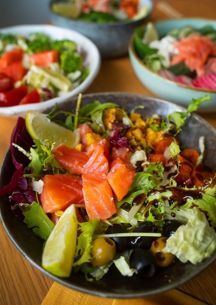 Free photo delicious salmon bowls on table arrangement