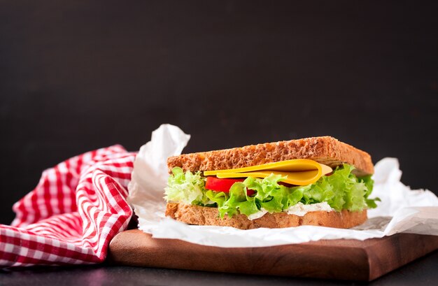 Delicious sandwich next to a tablecloth