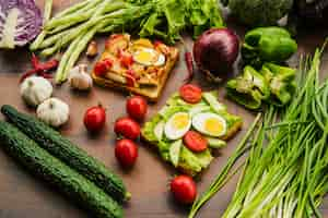 Free photo delicious sandwich with different healthy vegetables on wooden table