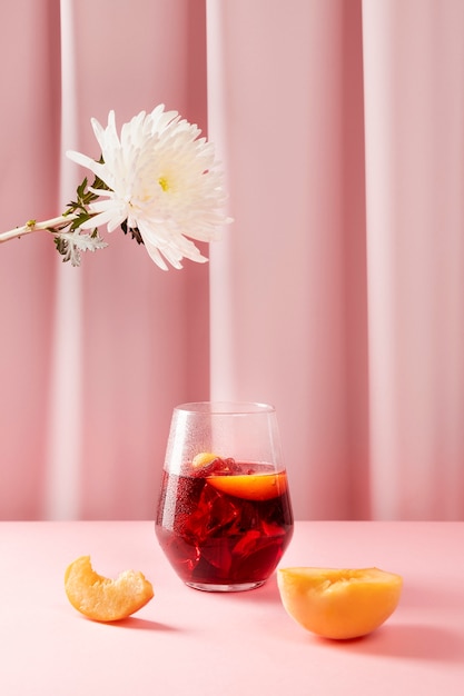 Delicious sangria, peach and flowers assortment