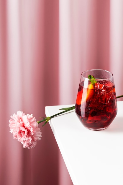 Delicious sangria with flower on table