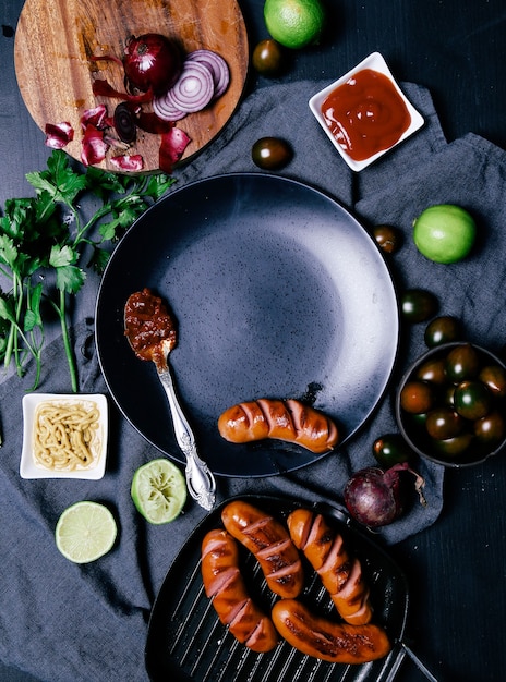 Delicious sausages on frying pan