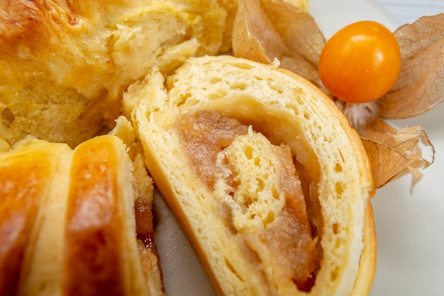 delicious sliced pastries inside plate with filling on white , pastry cookie biscuit sweet tea