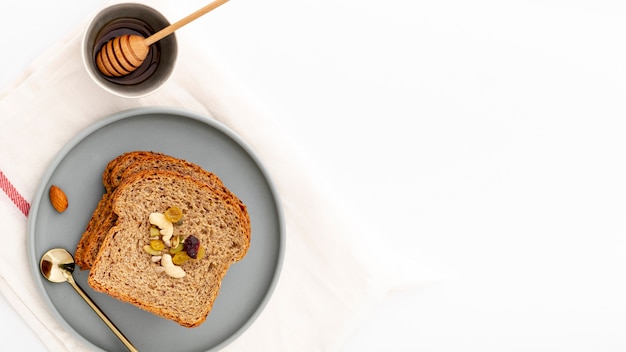 Foto gratuita fette di pane deliziose sul piatto con miele