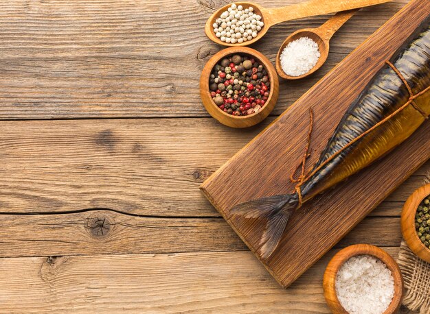 Delicious smoked fish on wooden board