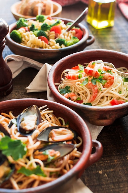 Delicious spaghetti with shrimps and mussels in the earthenware