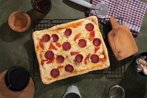 Delicious square pizza with pepperoni top view