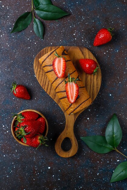 Delicious strawberry cake roll with fresh strawberries,top view