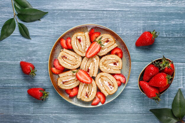 Delicious strawberry cake roll with fresh strawberries,top view