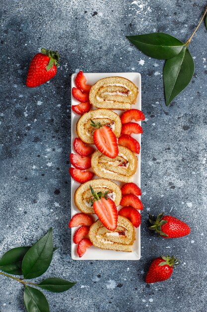 Delicious strawberry cake roll with fresh strawberries,top view