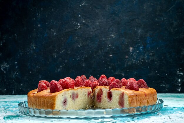 delicious strawberry cake sliced and whole delicious cake on bright desk, berry cake sweet bake