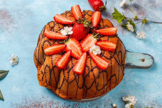 Delicious strawberry chocolate cake with fresh strawberries, top view