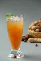 Free photo delicious sweet drink tamarind juice on gray surface