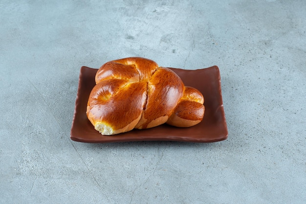 Free photo delicious sweet pastry on brown plate.