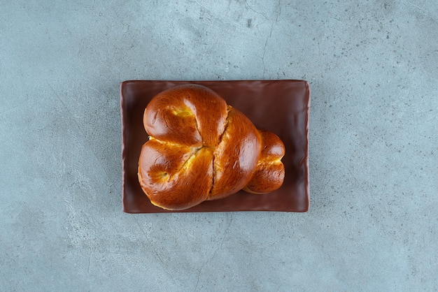 Free photo delicious sweet pastry on brown plate.