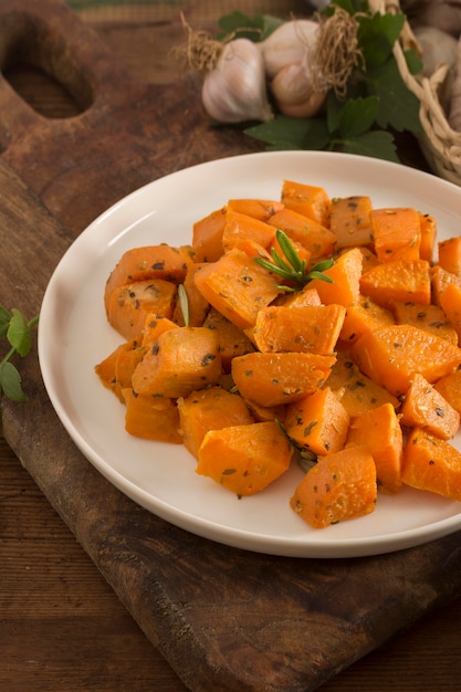 Delicious sweet potatoes on plate high angle
