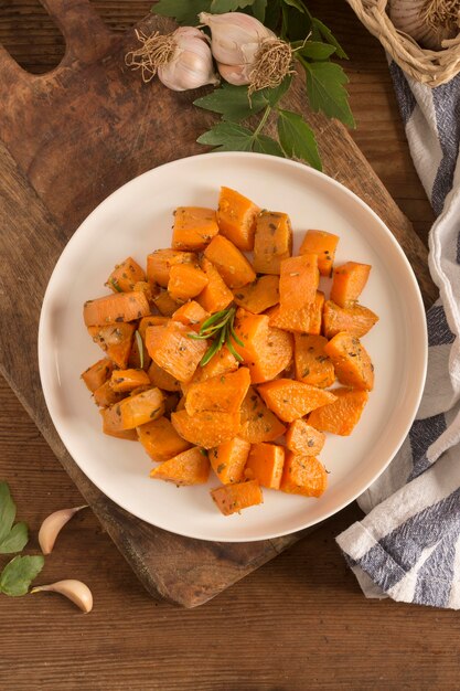 Delicious sweet potatoes on plate above view