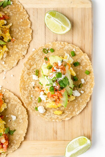 Delicious tacos on a wooden board