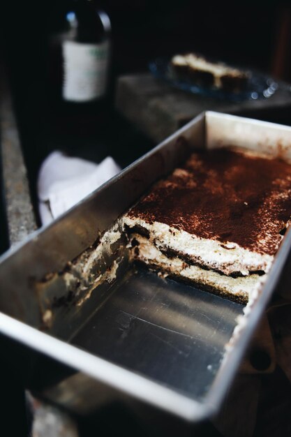 Delicious tiramisu cut in a deep oven tray a coffeeflavored Italian dessert