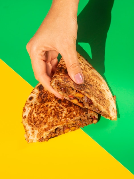 Delicious tortilla bread held in hands