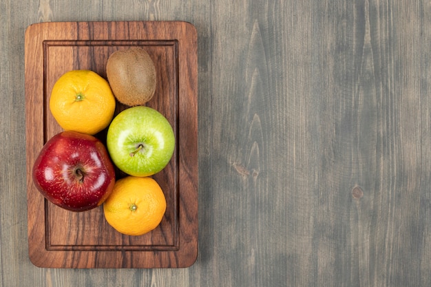 Delicious various fruits on a wooden table