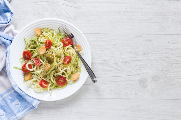 Delicious vegan pasta on plate with copy space