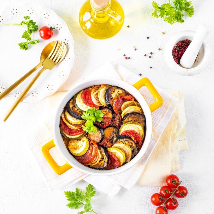Delicious vegetable ratatouille in a white baking dish on a wooden background
keto casserole recipes