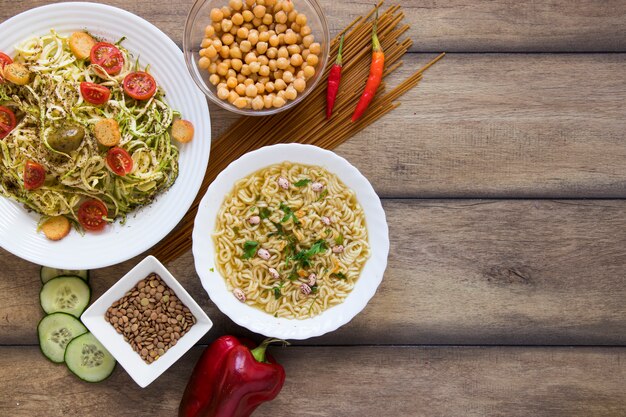 Delicious veggie food in plates with copy space