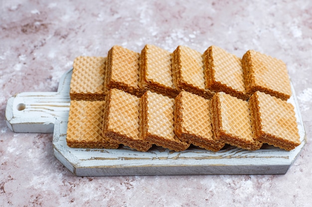 Free photo delicious wafers and a cup of coffee for breakfast, top view