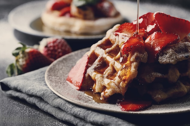 Delicious waffles with fruit and honey