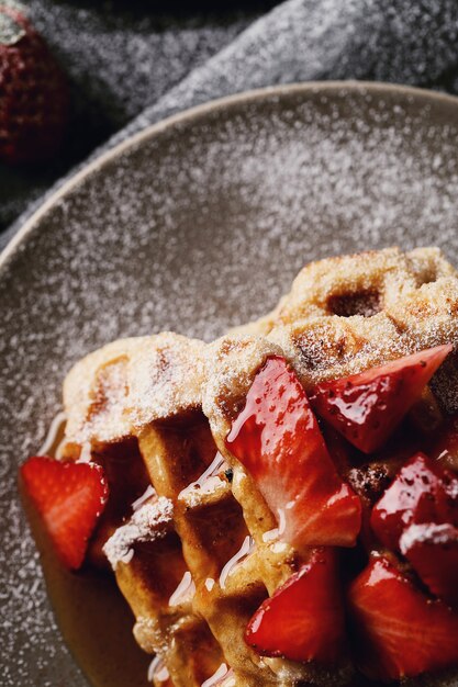 Delicious waffles with fruit and honey