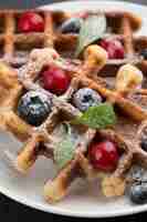 Free photo delicious waffles with fruits
