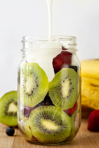 Free photo delicious yogurt jar with kiwi