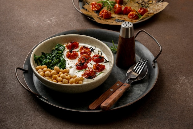 Delicious yougurt meal with chickpeas and dried tomatoes