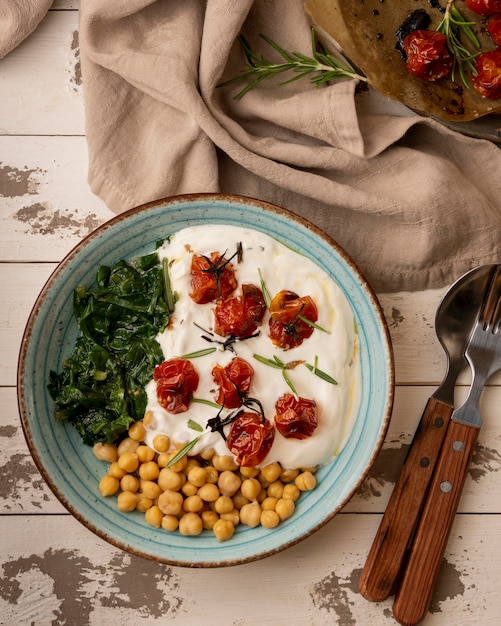 Delicious yougurt meal with chickpeas and dried tomatoes