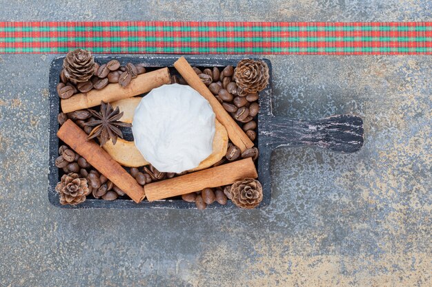 Delicious zephyr with coffee beans and pinecones. High quality photo