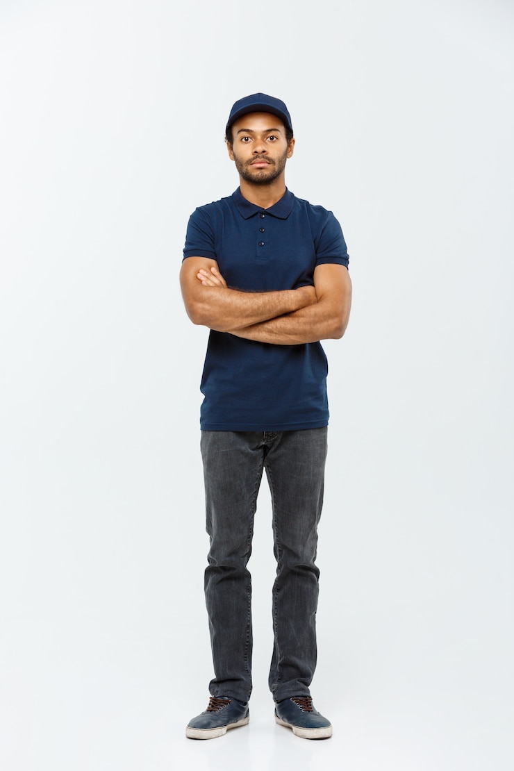 Free Photo delivery concept - handsome african american delivery man. isolated on grey studio background. copy space.